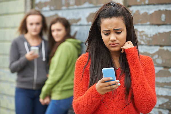 Image depicting cyber bullying on phone