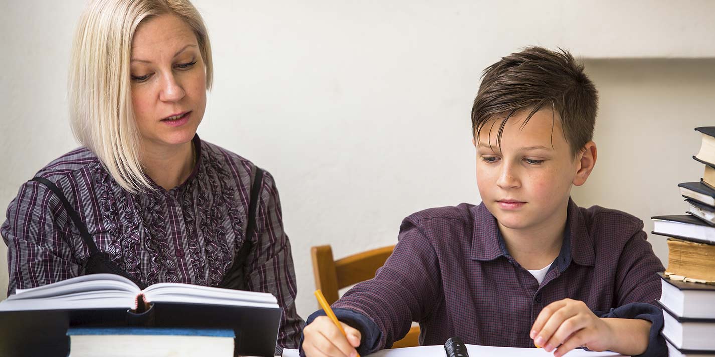 Mother and son home schooling